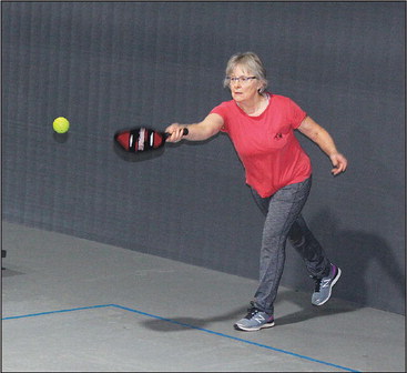 Playing pickle ball