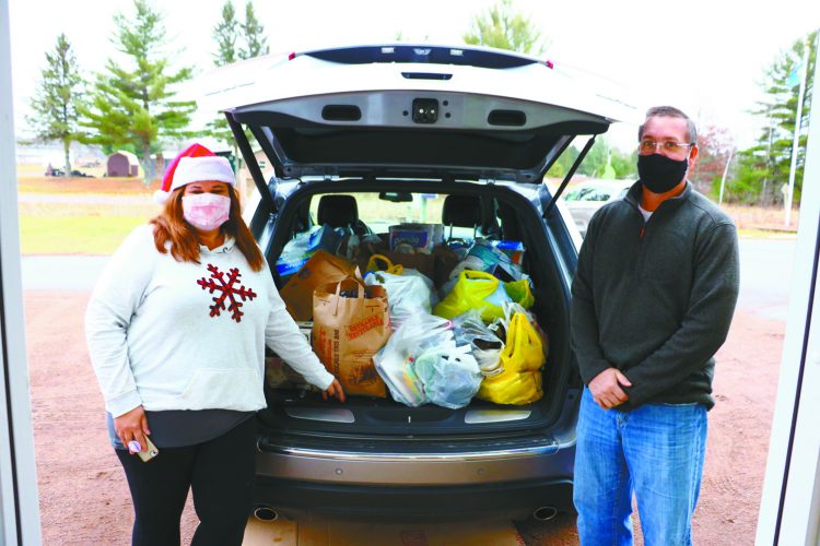 Couple with Holcombe ties fills Jeep for food pantry