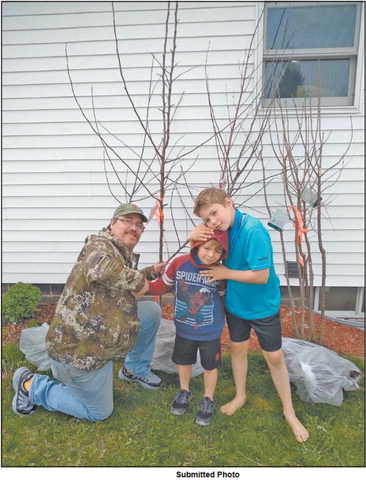 Youth takes on job of replanting trees taken by tornado