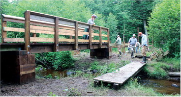 Crew comes together to build Ice Age trail bridge Crew comes together to build Ice Age trail bridge