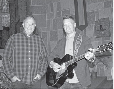 Duo shares songs of faith and action at Holy Rosary