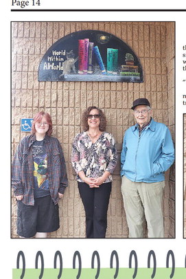 New library sign invites patrons to explore a ‘world within a world’