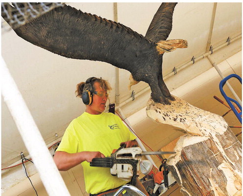 Gilman artist carves a niche with wooden statues