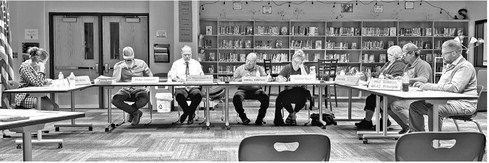 Gilman looks at pay for school board members