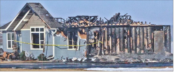 Garage fire destroys house near Colby