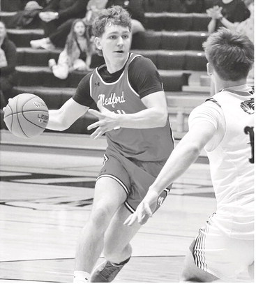 Medford sticks with Tigers until last five minutes in loss