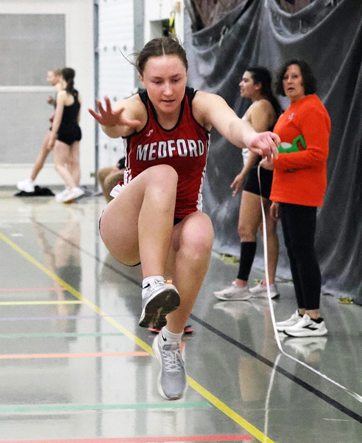 Kahn takes mile, Tlusty wins hurdles in Marshfield opener