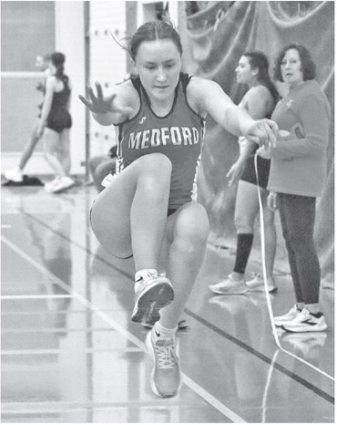 Kahn takes mile, Tlusty wins hurdles in Marshfield opener