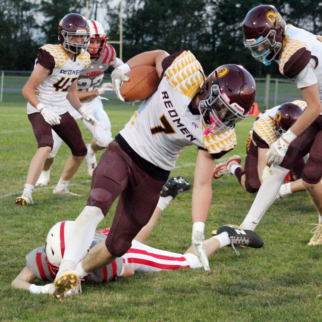 Game swings on key plays early, then Thorp wears down Redmen