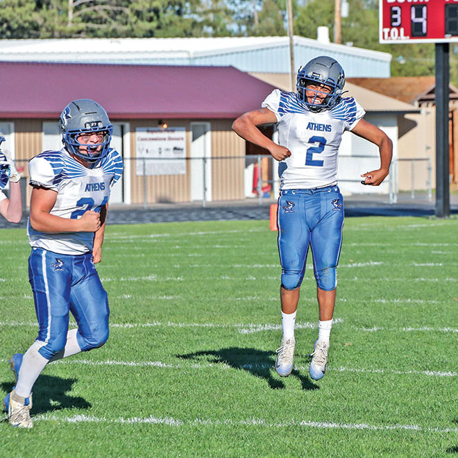 Athens wins road playoff opener